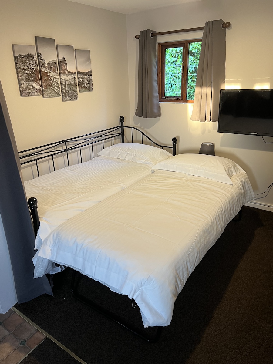 Room with day bed/trundle bed arranged as a double